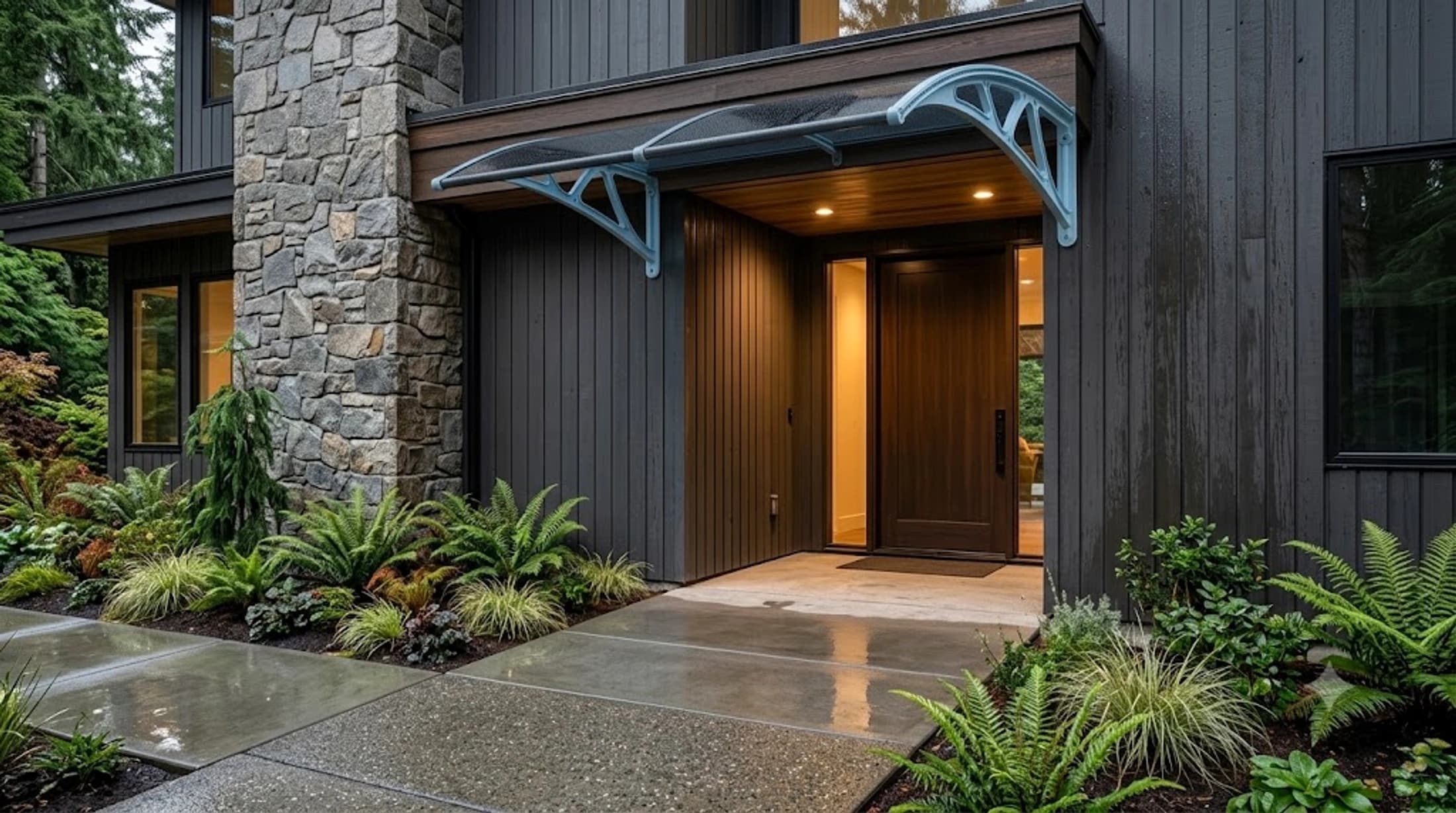 Completed custom awning installed over a modern home entrance